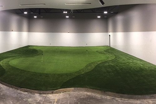Premium nylon turf surface and contour system detail for a DFW indoor green